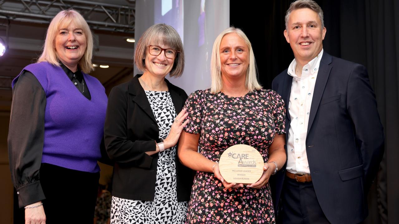 A colleague of the NHS Business Services Authority receiving the award for 'inclusive leader' at the internal 'we care' awards.