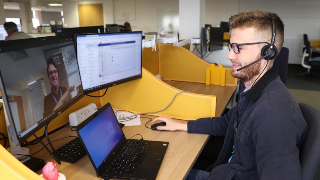 Colleague sitting at a desk wearing a headset